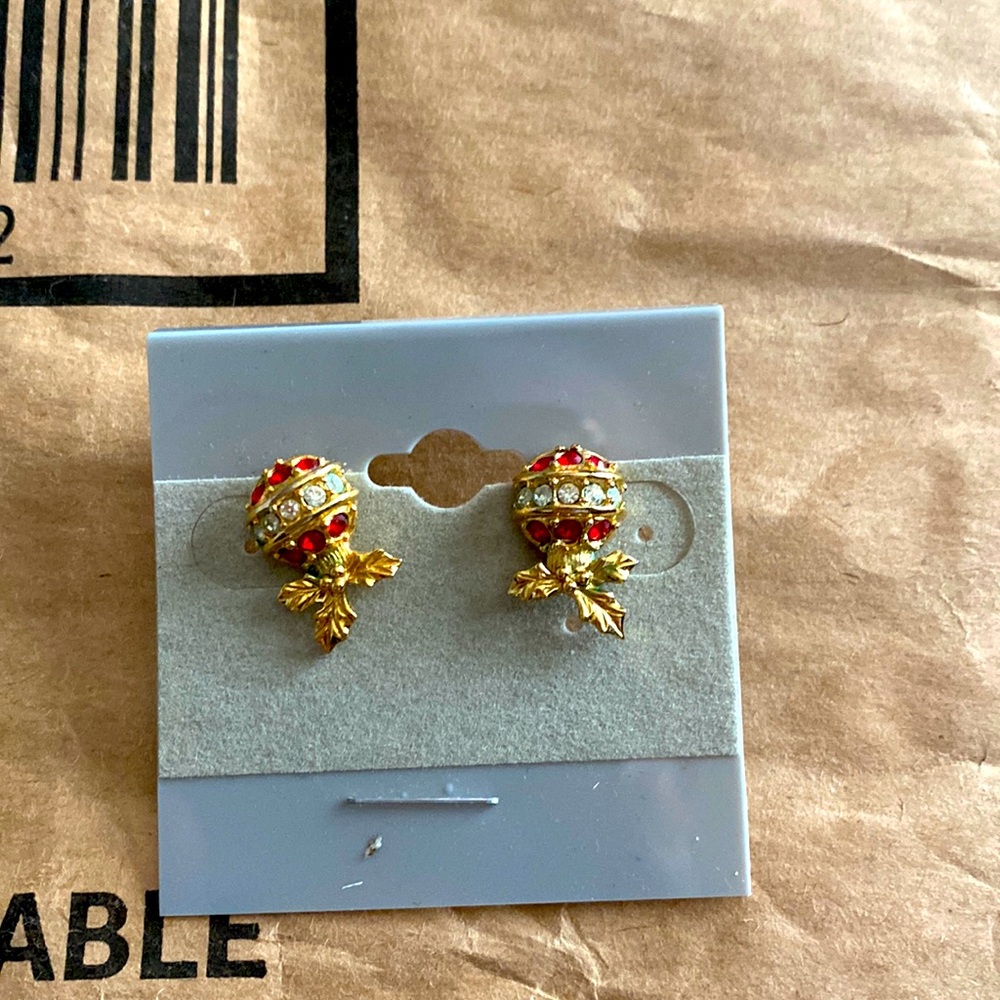 Balloon style earrings gold color with red stones and clear stones.